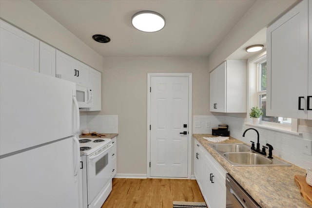 1406 S Cedar St Unit 1408, Spokane, WA 99203 - kitchen with white appliances, backsplash, white cabinets, and light wood-type flooring