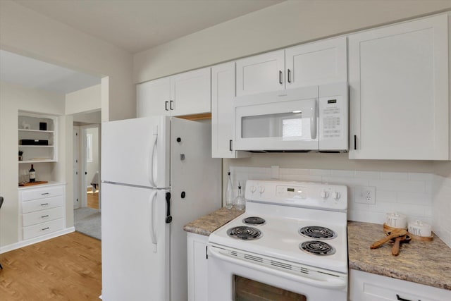 1406 S Cedar St Unit 1408, Spokane, WA 99203 - kitchen with white appliances, white cabinetry, decorative backsplash, and light wood-style flooring