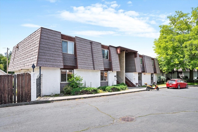 1716 N Pettet Dr Apt 2, Spokane, WA 99205 - view of building exterior featuring uncovered parking