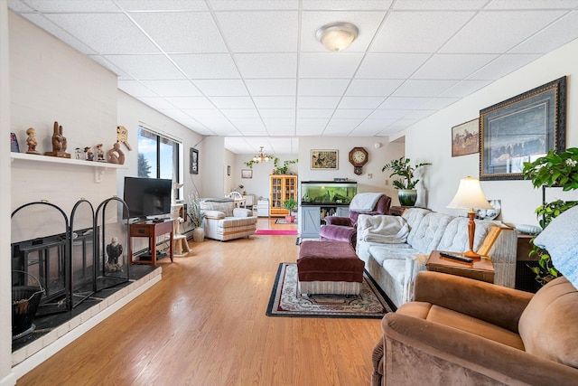 1716 N Pettet Dr Apt 2, Spokane, WA 99205 - living room with light wood finished floors and a paneled ceiling