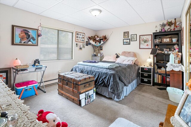 1716 N Pettet Dr Apt 2, Spokane, WA 99205 - bedroom featuring carpet, a drop ceiling, and a baseboard radiator