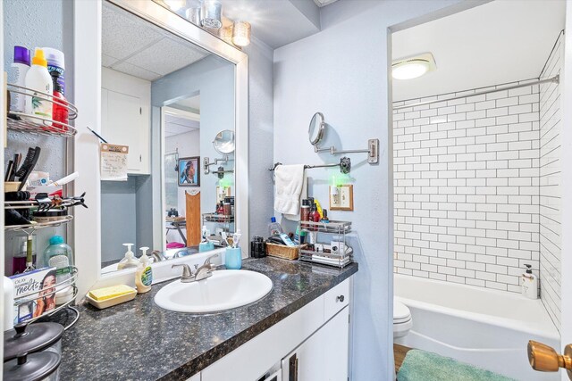 1716 N Pettet Dr Apt 2, Spokane, WA 99205 - full bathroom with vanity, shower / tub combination, and a paneled ceiling