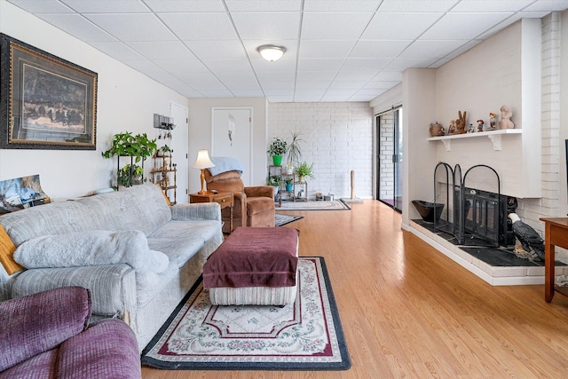 1716 N Pettet Dr Apt 2, Spokane, WA 99205 - living area featuring wood finished floors and a drop ceiling
