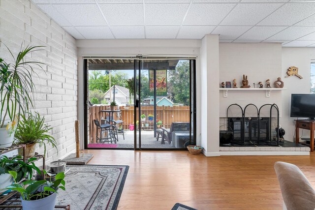 1716 N Pettet Dr Apt 2, Spokane, WA 99205 - living room featuring wood finished floors and a drop ceiling