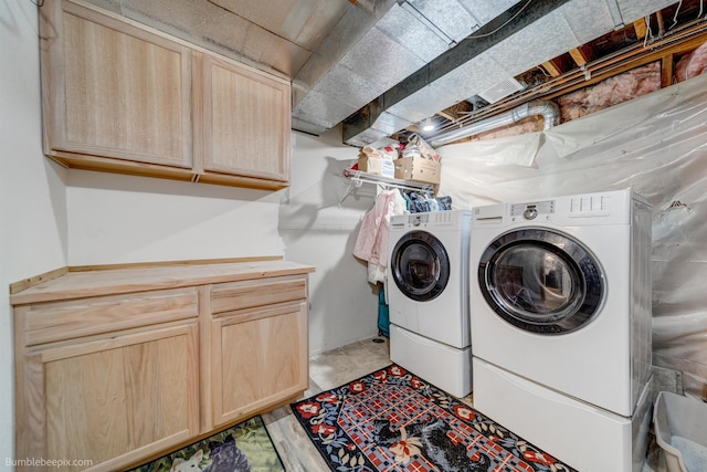 1612 E Sharpsburg Ave, Spokane, WA 99217 - washroom with cabinet space and washer and dryer
