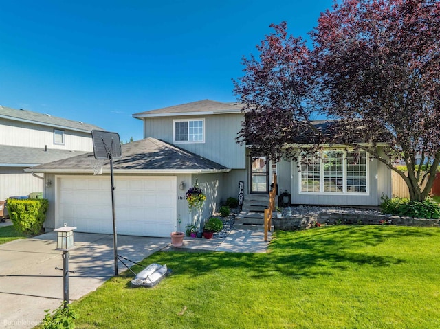 1612 E Sharpsburg Ave, Spokane, WA 99217 - tri-level home with concrete driveway, a front yard, and an attached garage
