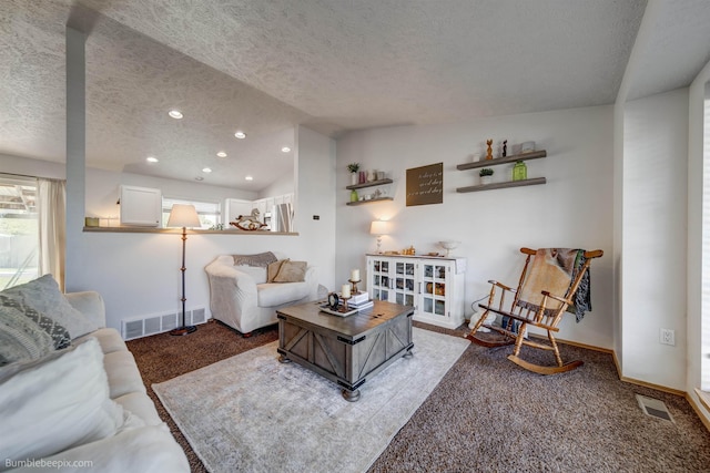 1612 E Sharpsburg Ave, Spokane, WA 99217 - carpeted living room featuring a textured ceiling, recessed lighting, and vaulted ceiling