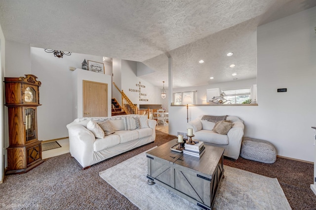 1612 E Sharpsburg Ave, Spokane, WA 99217 - carpeted living room with a textured ceiling, stairs, and recessed lighting