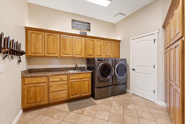 7105 S Saddle Ridge Ln, Spokane Valley, WA 99016 - laundry area with cabinet space, washing machine and clothes dryer, and light tile patterned floors