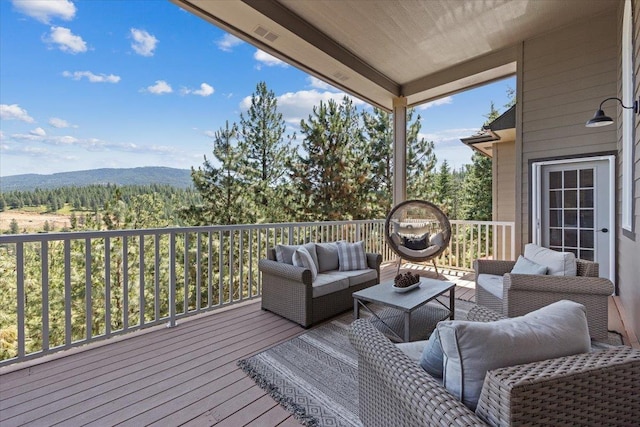 7105 S Saddle Ridge Ln, Spokane Valley, WA 99016 - deck with an outdoor hangout area and a wooded view
