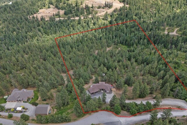 7105 S Saddle Ridge Ln, Spokane Valley, WA 99016 - aerial view of property's location with a forest and property boundaries highlighted