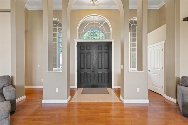7105 S Saddle Ridge Ln, Spokane Valley, WA 99016 - entrance foyer with ornamental molding, wood finished floors, and arched walkways