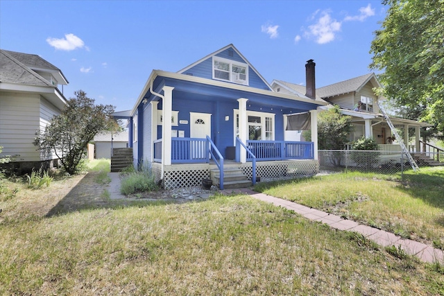 2505 W Mallon Ave, Spokane, WA 99201 - view of front of home with a porch, a front yard, and a chimney
