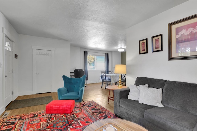 2505 W Mallon Ave, Spokane, WA 99201 - living area with wood finished floors and a textured ceiling