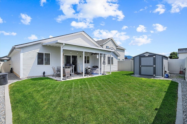 124 S Lone Tree Ave, Spokane Valley, WA 99016 - back of property featuring a shed, a fenced backyard, and a patio area