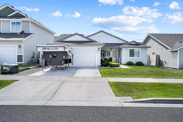 124 S Lone Tree Ave, Spokane Valley, WA 99016 - view of front of house featuring driveway, an attached garage, a front lawn, and a shingled roof