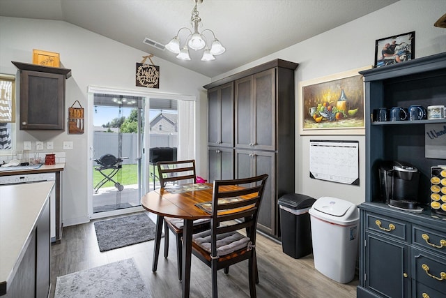 124 S Lone Tree Ave, Spokane Valley, WA 99016 - dining area with lofted ceiling, a chandelier, and light wood-style floors