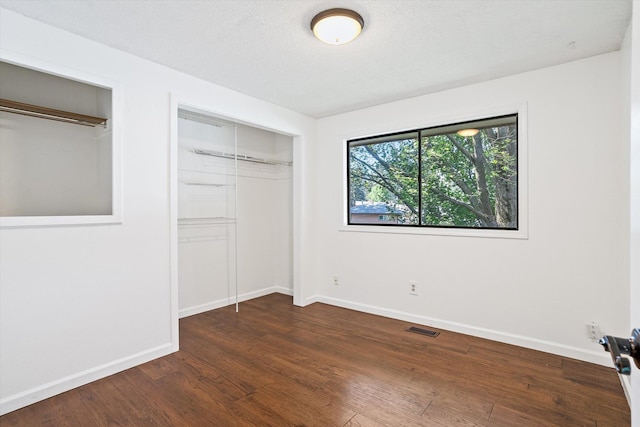 317 E Eaton Ave, Spokane, WA 99218 - unfurnished bedroom with wood finished floors and baseboards