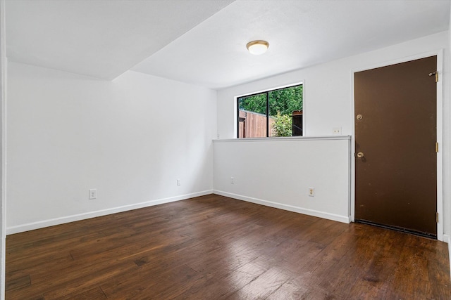 317 E Eaton Ave, Spokane, WA 99218 - empty room with wood finished floors and baseboards