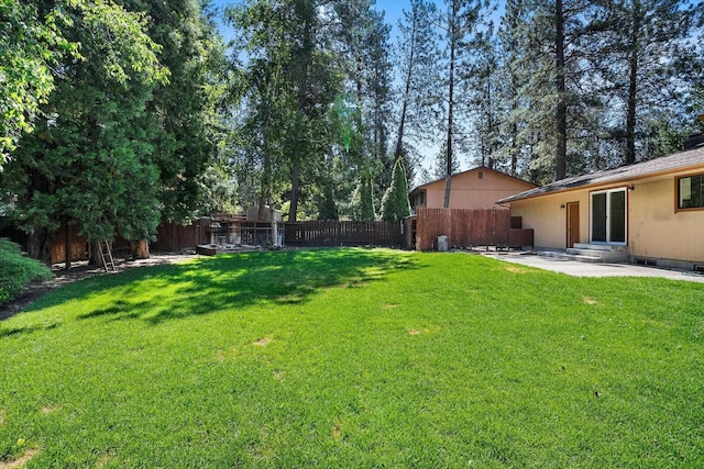 317 E Eaton Ave, Spokane, WA 99218 - fenced backyard featuring a patio area and entry steps
