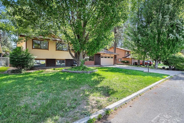 317 E Eaton Ave, Spokane, WA 99218 - view of front of property featuring a front lawn, driveway, and an attached garage