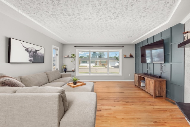 1718 S Bolivar Rd, Spokane Valley, WA 99037 - living area featuring light wood finished floors and a textured ceiling