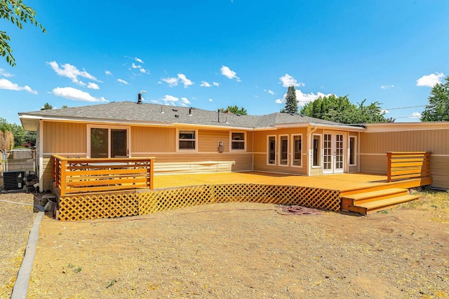 1718 S Bolivar Rd, Spokane Valley, WA 99037 - rear view of house with a wooden deck, french doors, and a shingled roof