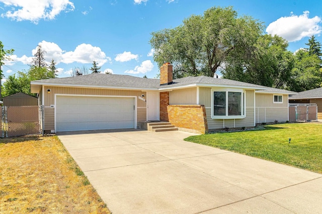 1718 S Bolivar Rd, Spokane Valley, WA 99037 - single story home with a chimney, a gate, driveway, and a garage