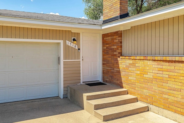1718 S Bolivar Rd, Spokane Valley, WA 99037 - doorway to property with a chimney, brick siding, and roof with shingles
