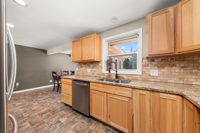 1718 S Bolivar Rd, Spokane Valley, WA 99037 - kitchen featuring appliances with stainless steel finishes, light brown cabinetry, backsplash, light stone counters, and recessed lighting