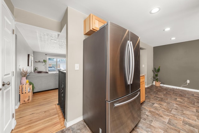 1718 S Bolivar Rd, Spokane Valley, WA 99037 - kitchen with freestanding refrigerator, light brown cabinets, open floor plan, and recessed lighting