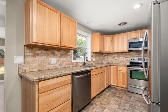1718 S Bolivar Rd, Spokane Valley, WA 99037 - kitchen with stainless steel appliances, light brown cabinets, backsplash, and recessed lighting
