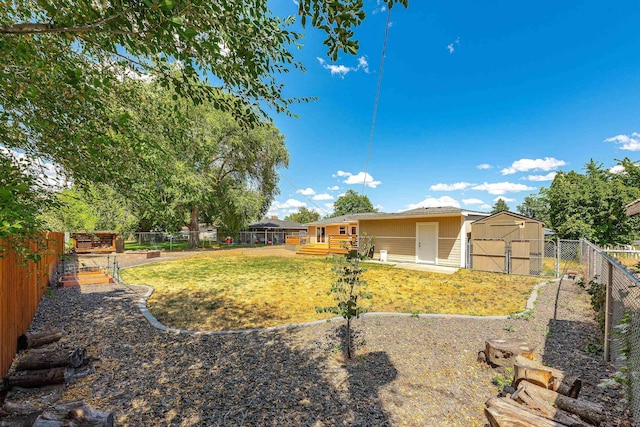 1718 S Bolivar Rd, Spokane Valley, WA 99037 - fenced backyard featuring a storage shed