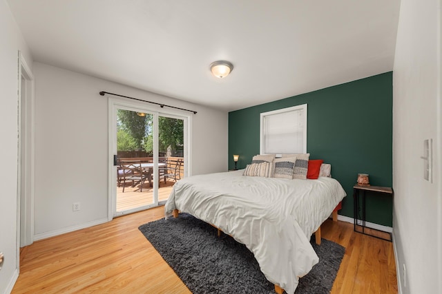 1718 S Bolivar Rd, Spokane Valley, WA 99037 - bedroom with access to exterior and light wood finished floors