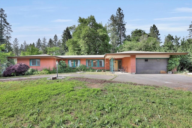 2411 E Girard Pl, Spokane, WA 99223 - single story home featuring asphalt driveway, a garage, and brick siding