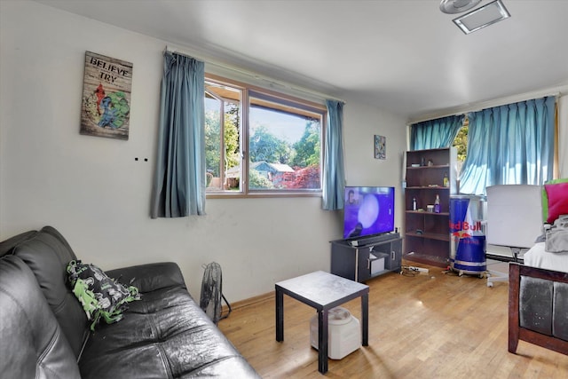 2411 E Girard Pl, Spokane, WA 99223 - living room with healthy amount of natural light and wood finished floors