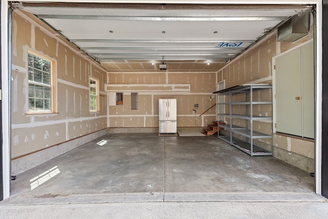9909 N Ivanhoe Rd, Spokane, WA 99218 - garage with freestanding refrigerator and electric panel