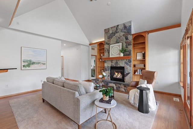 9909 N Ivanhoe Rd, Spokane, WA 99218 - living area with a stone fireplace, wood finished floors, and high vaulted ceiling