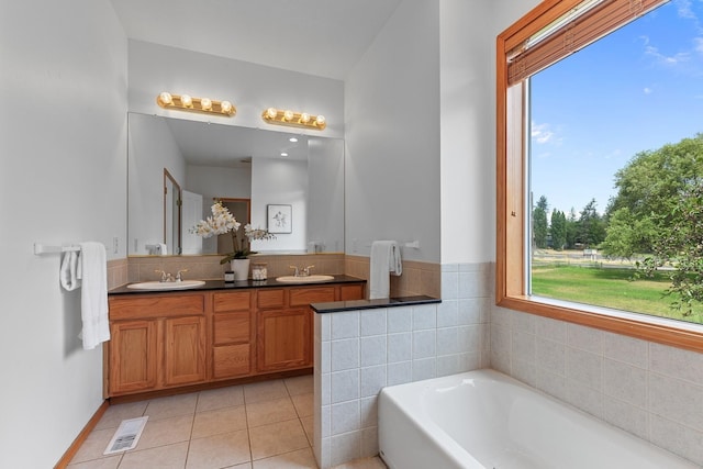 9909 N Ivanhoe Rd, Spokane, WA 99218 - bathroom featuring double vanity, a bath, and tile patterned floors