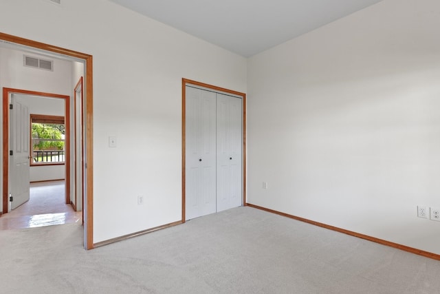 9909 N Ivanhoe Rd, Spokane, WA 99218 - unfurnished bedroom with carpet flooring and a closet