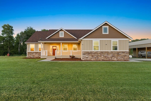37818 N Grove Rd, Deer Park, WA 99006 - craftsman-style home featuring stone siding, a porch, a front yard, board and batten siding, and a shingled roof