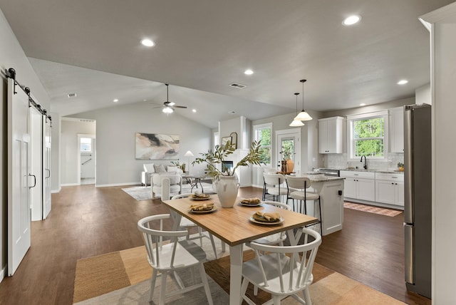 37818 N Grove Rd, Deer Park, WA 99006 - dining area with a barn door, dark wood-style flooring, ceiling fan, recessed lighting, and lofted ceiling