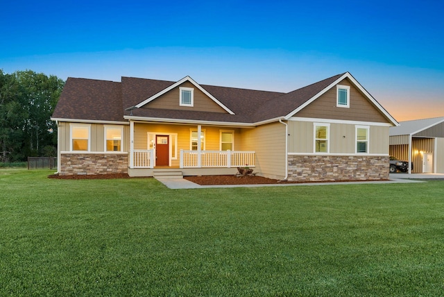 37818 N Grove Rd, Deer Park, WA 99006 - craftsman-style home featuring stone siding, covered porch, board and batten siding, and a lawn