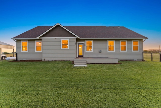 37818 N Grove Rd, Deer Park, WA 99006 - back of property at dusk featuring roof with shingles and a deck