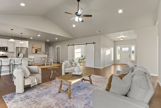37818 N Grove Rd, Deer Park, WA 99006 - living room featuring a barn door, recessed lighting, wood finished floors, a ceiling fan, and high vaulted ceiling