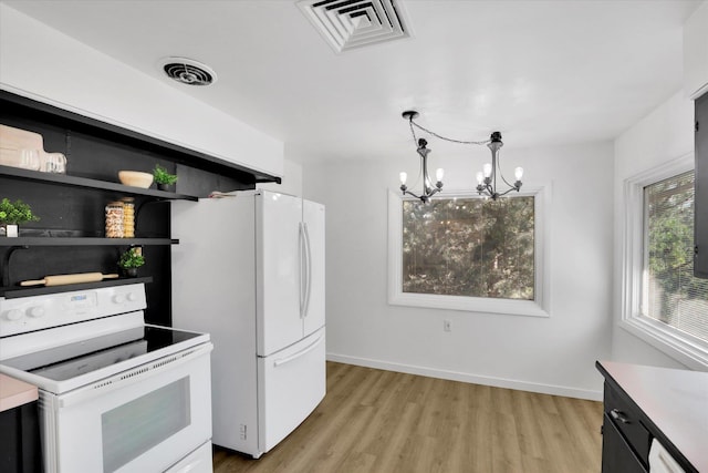 1102 S Buena Vista Dr, Spokane, WA 99224 - kitchen featuring white appliances, a chandelier, light wood-type flooring, decorative light fixtures, and light countertops