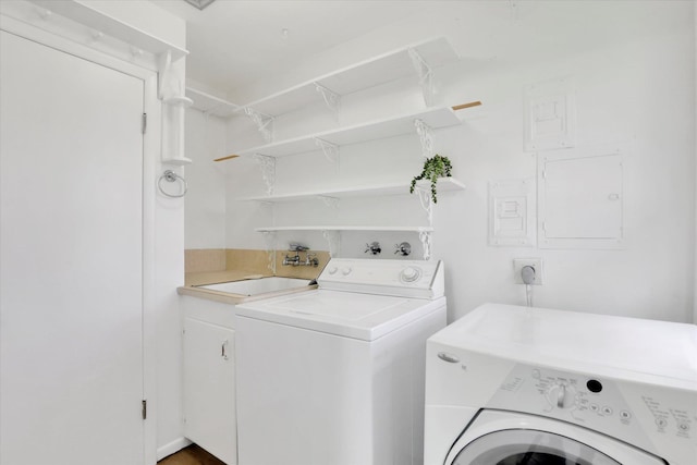 1102 S Buena Vista Dr, Spokane, WA 99224 - laundry room with washing machine and dryer and cabinet space