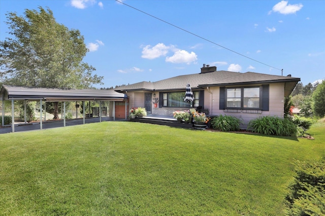 1102 S Buena Vista Dr, Spokane, WA 99224 - view of front of property with a front yard, a chimney, and a detached carport
