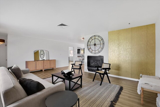 1102 S Buena Vista Dr, Spokane, WA 99224 - living room featuring wood finished floors and a large fireplace