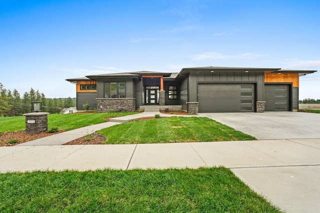 5206 S Willamette St, Spokane, WA 99223 - prairie-style home with a garage, board and batten siding, stone siding, driveway, and a front yard
